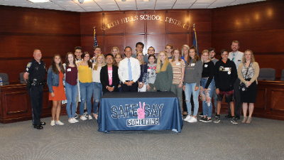Pennsylvania Attorney General Josh Shapiro poses with North Hills High School students following a Safe2Say roundtable discussion.