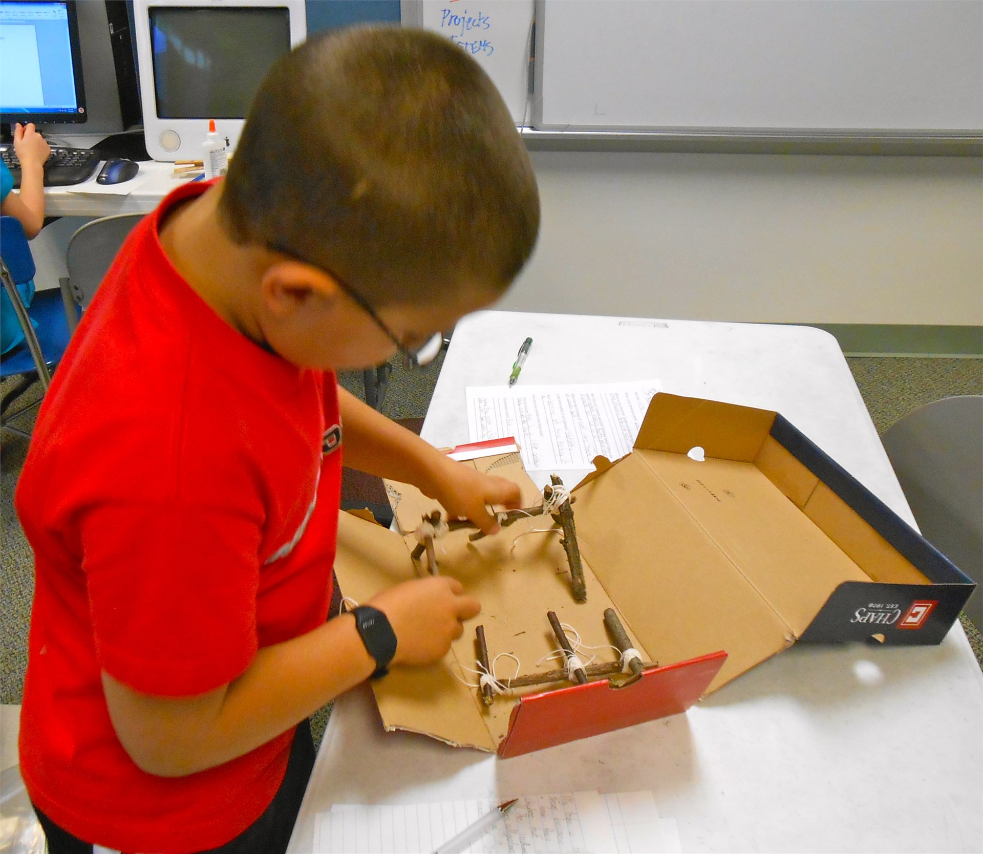 Fourth graders create models of Native American structures