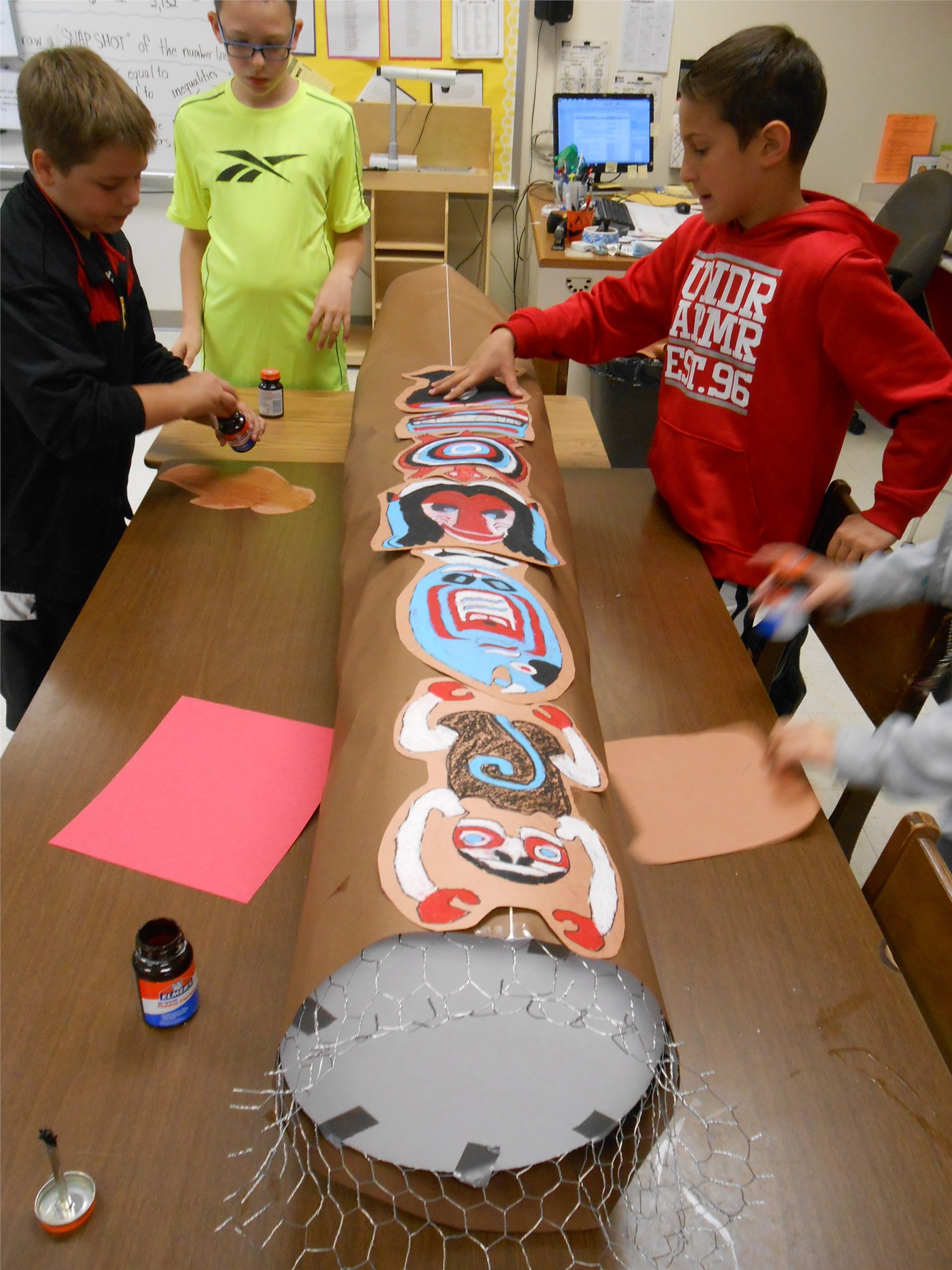 grade 6 constructs large totem poles