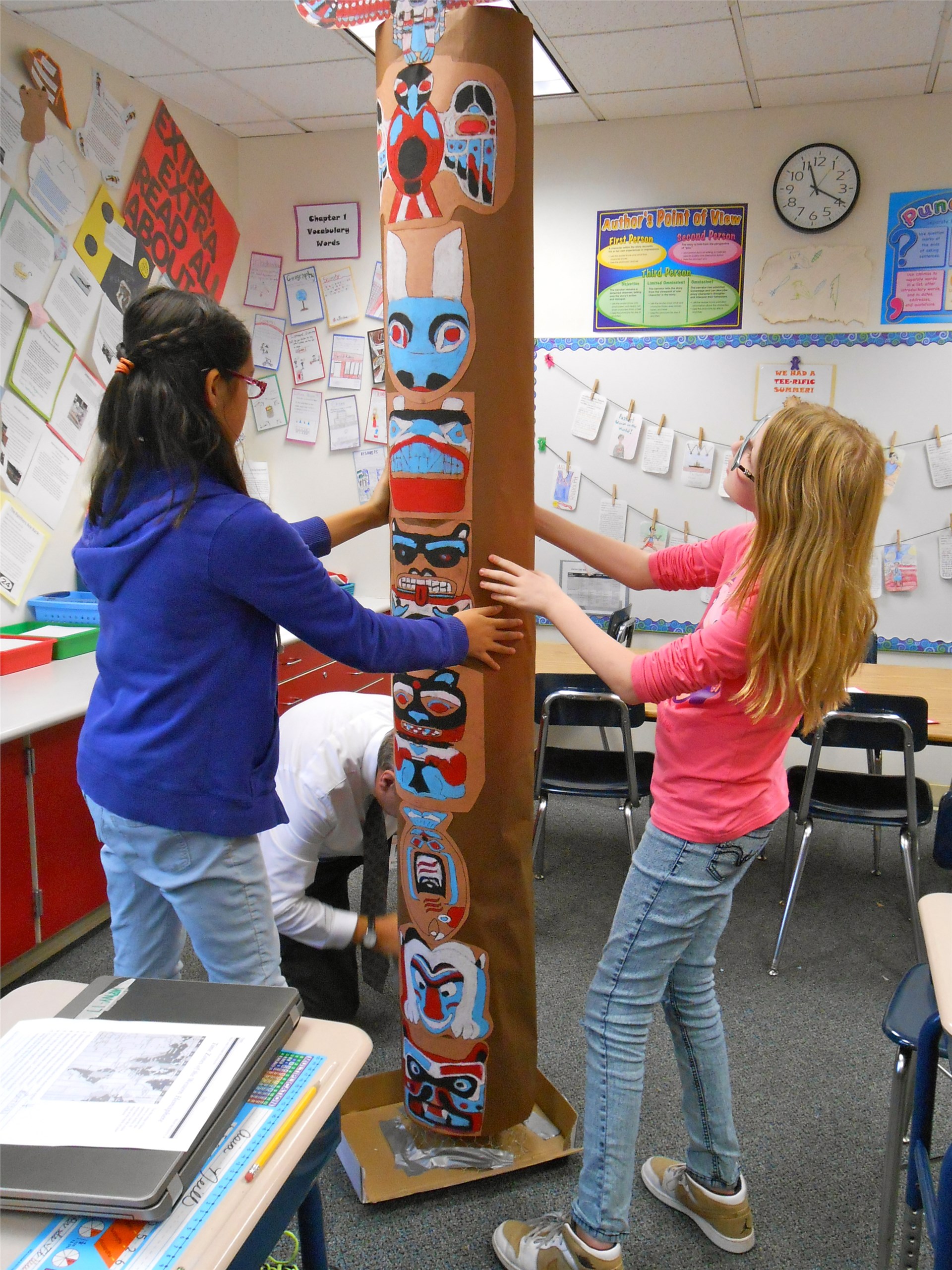 grade 6 constructs large totem poles