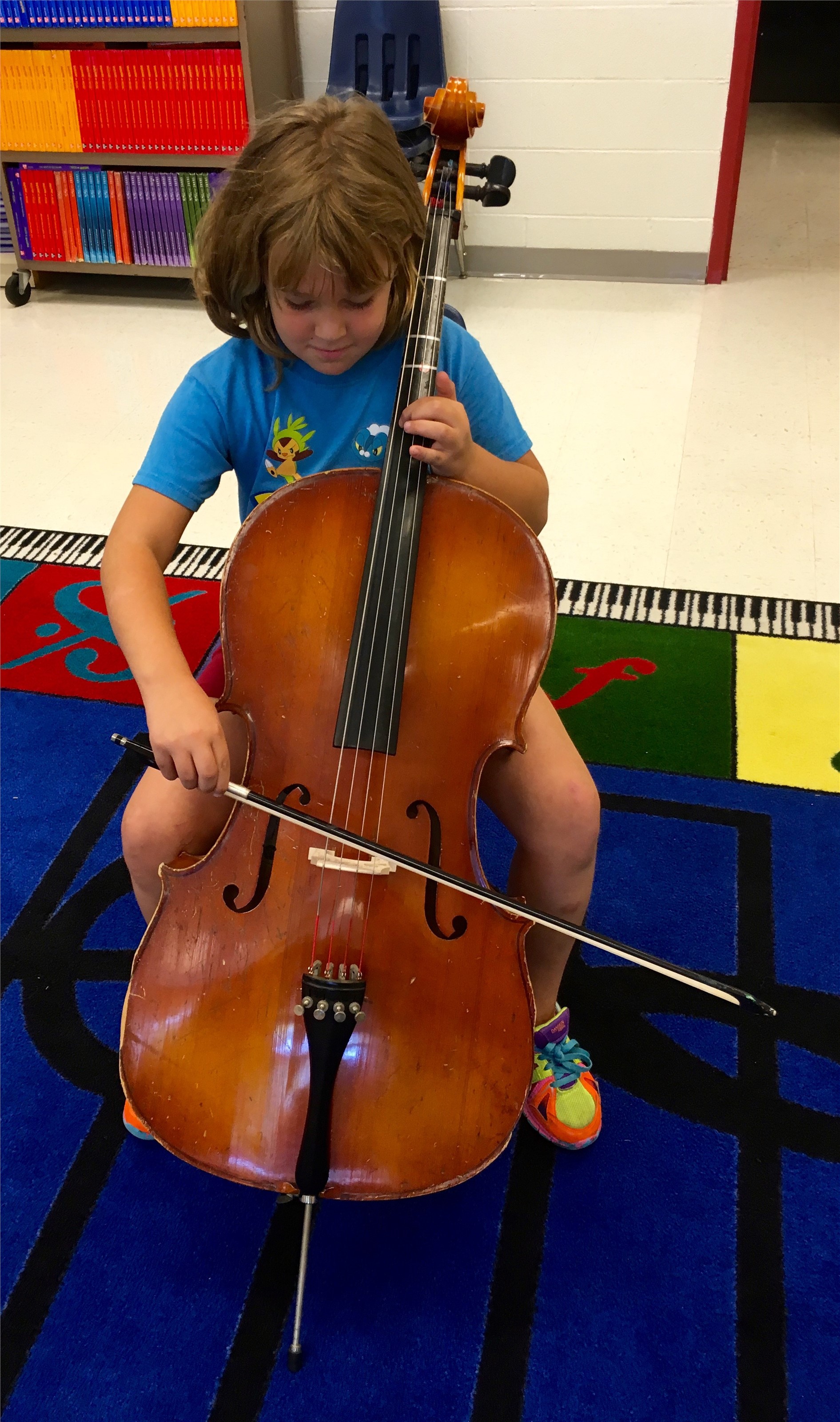 Trying out a cello.