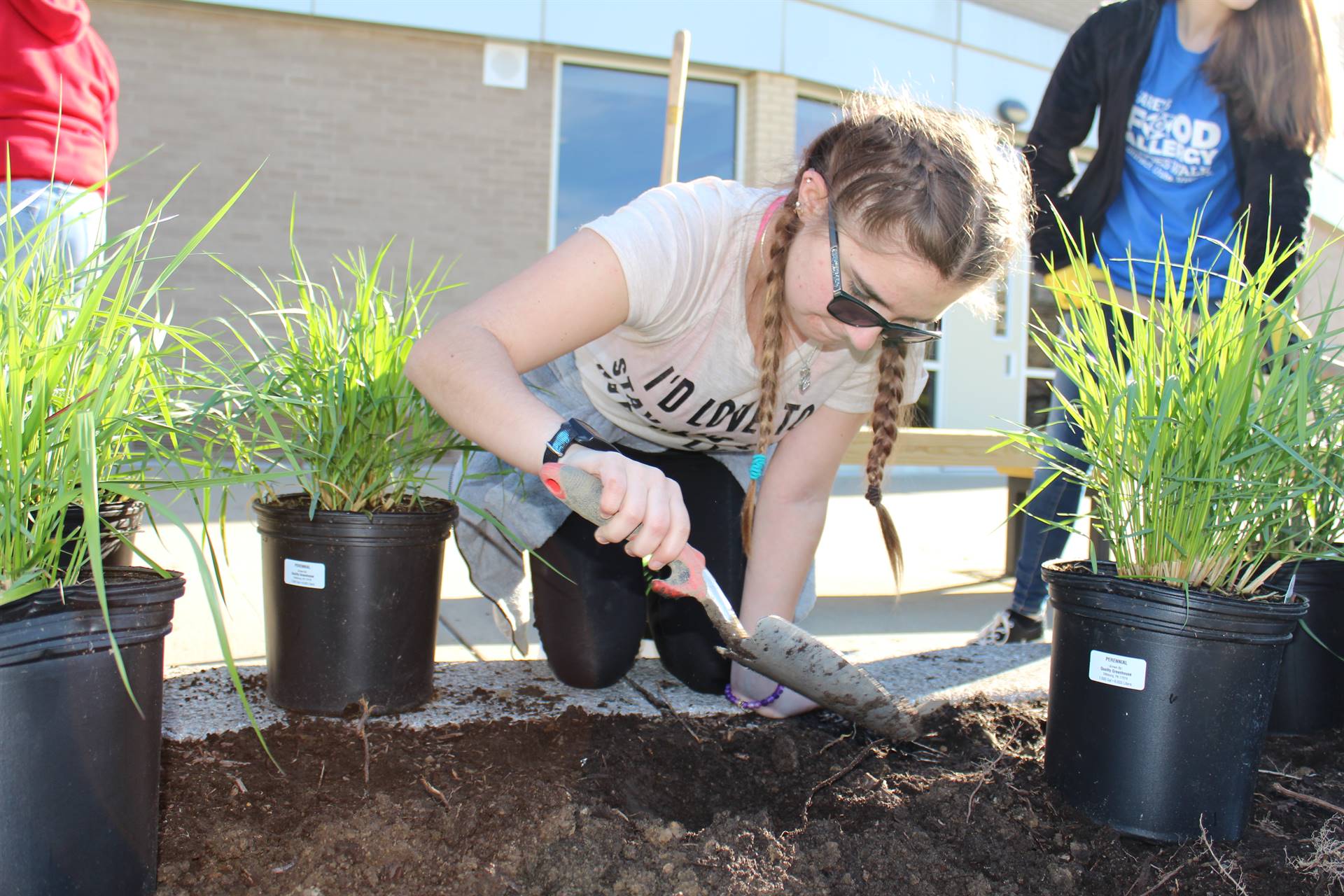 High School Students Planting Garden